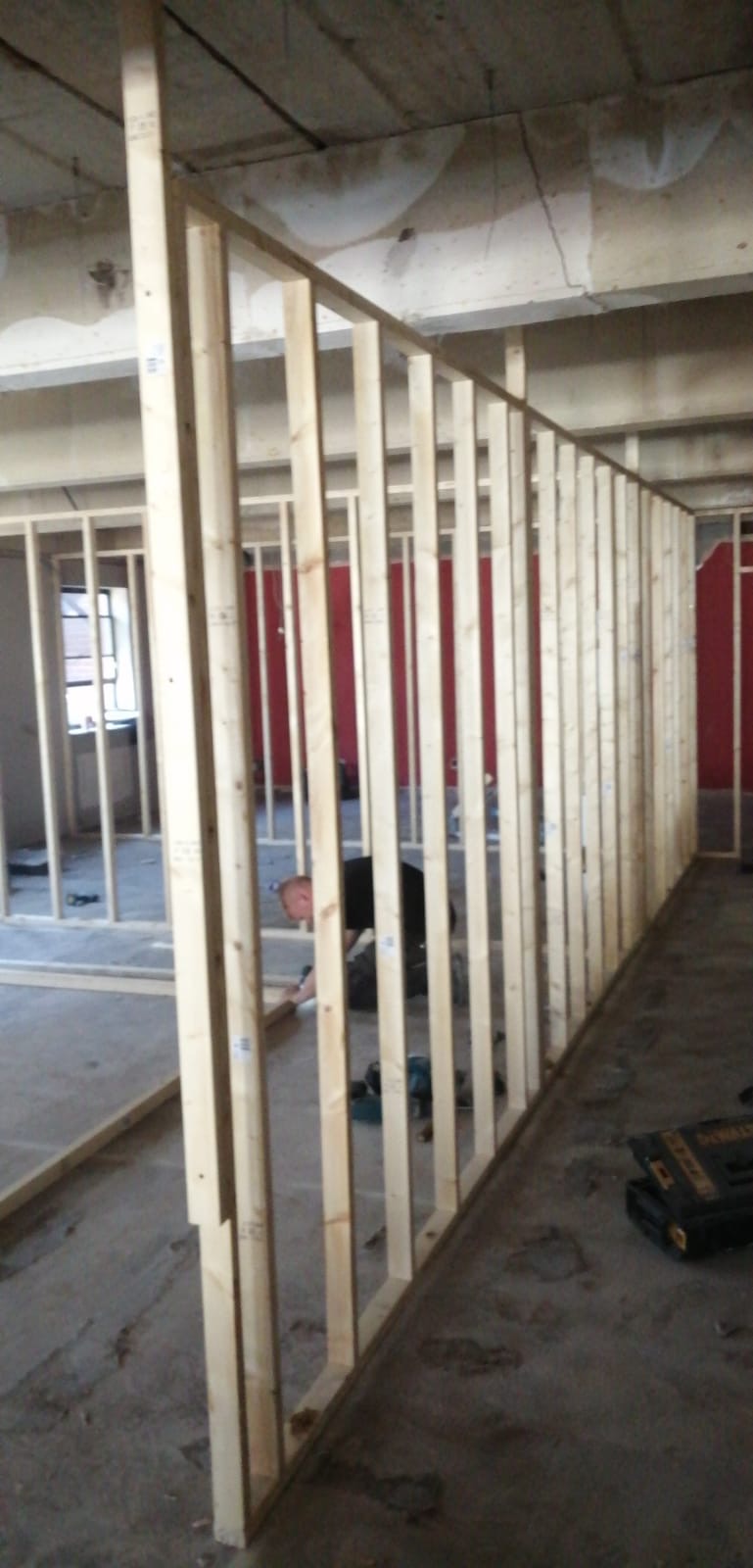 Stud partition wall framing under construction during a refurbishment